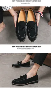 Detailansicht schicker schwarzer Wildleder-Loafer mit Quasten und weißen Nähten