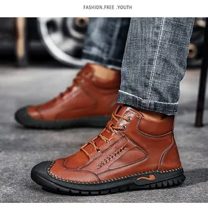 Side view detail of men's brown high-top leather work boots with lace-up design