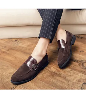 Detailed close-up of brown retro loafers featuring a blend of suede and smooth leather
