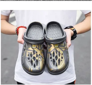 Detailed view of large size men's breathable clogs with gold patterns and anti-slip soles