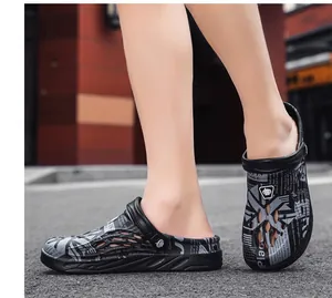 Close-up detail of men's outdoor breathable clogs with grey newspaper print design
