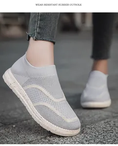Close-up of breathable knit mesh upper and speckled rubber outsole on slip-on sneaker.
