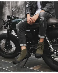 Detail view of men's vintage olive green outdoor Martin boots with a stylish black toe cap