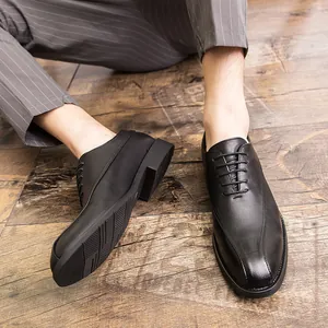 Elegant black pointed-toe men's business casual leather dress shoes with oxford lacing