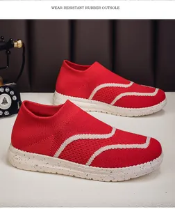 Red breathable knitted slip-on sneakers featuring a durable speckled rubber outsole.