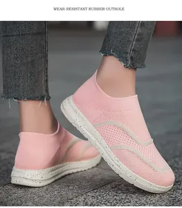Breathable pink knit slip-on sneakers featuring a durable wear-resistant rubber outsole