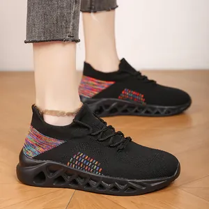 Breathable fly-knit sneakers for men and women with colorful accents and hollow soles