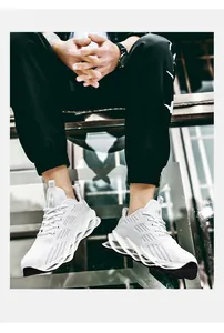 Detailed side view of white men's blade running shoes featuring breathable fly-knit upper.
