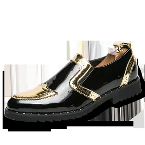 Detailed side view of black patent leather Brogue shoes with gold accents and thick lug sole