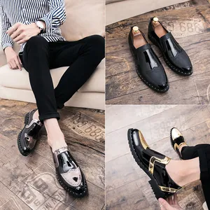 Close-up of stylish men's brogue leather shoes with metallic accents and studs