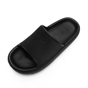 Black thick-soled pillow slides for summer indoor and outdoor use with textured finish