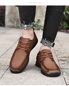 Detail view of men's brown outdoor leather shoes with lace-up design and thick sole