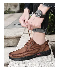 Detailed shot of men's casual brown leather outdoor shoes with breathable perforations