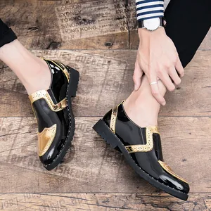 Close-up detail of men's black patent leather Brogue shoes with stylish gold metallic accents.