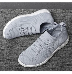 Detailed view of grey flyknit mesh fabric on women's slip-on walking shoes