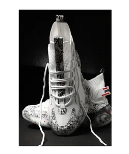 Detail view of white high-top basketball sneakers featuring stylish black marble patterns