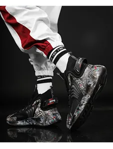 Close-up detail of high-top basketball sneakers featuring marbled soles and decorative SOP straps