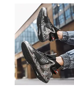 Action shot showing the marbled midsole detail of high-top basketball sneakers