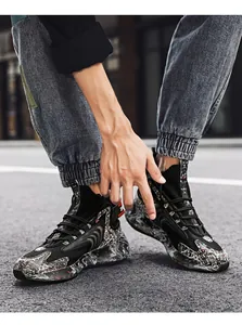 Close-up of stylish high-top men's basketball sneakers with marble pattern details.