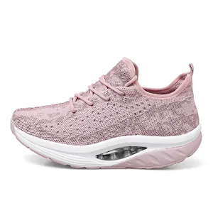 Stylish pink breathable flyknit mesh rocker sneakers with a visible air cushion platform sole