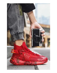 Detailed side view of red high-top basketball sneakers with stylish marble pattern soles