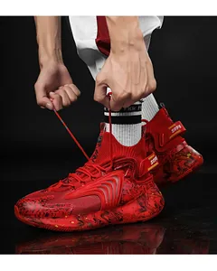Detail of red high-top basketball sneakers with black marble pattern sole and breathable mesh.