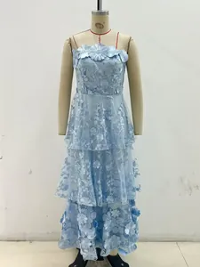 Detail view of a light blue tiered strapless dress with 3D floral appliqué details