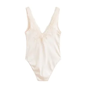 Full view detail of silky satin bodysuit featuring ornate floral lace trim v-neck
