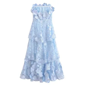 Detailed view of the 3D floral lace embroidery on light blue tiered strapless dress