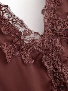Close-up of elegant coffee brown satin bodysuit with intricate floral lace trim detail