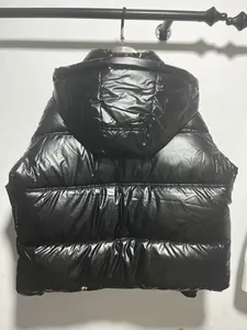Detailed back view of metallic black glossy hooded puffer jacket with warm padding