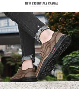 Close-up detail of brown breathable leather outdoor shoes with thick rugged soles.