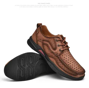 A detailed professional photograph of brown breathable leather outdoor shoes with non-slip thick soles
