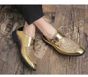 Detailed shot of gold metallic and glitter pointed-toe monk strap men's dress shoes.
