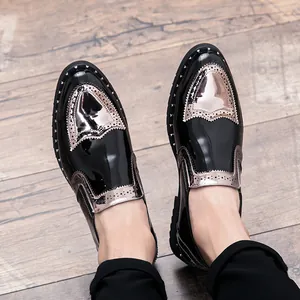 Detail view of men's patent leather brogue shoes with stylish metallic rivet studs
