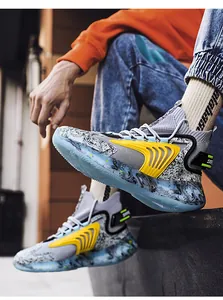 Detailed view of high-top basketball shoes featuring a unique blue marble sole and yellow side cage
