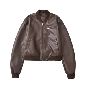 Detailed view of a vintage brown faux leather bomber jacket featuring a front silver zipper.