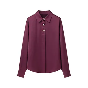 Elegant burgundy satin blouse featuring unique gold buttons and a classic collar