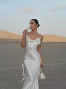 Elegant white satin backless party dress with side ribbon bow and cowl neck for women