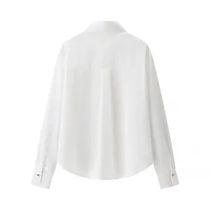 Back view of elegant white satin blouse with golden buttons on cuffs and pleat detail