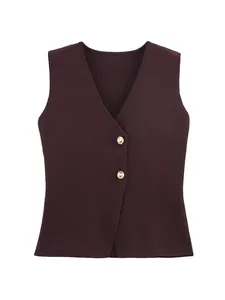 Detailed macro view of a dark burgundy knitted vest with elegant gold button accents.