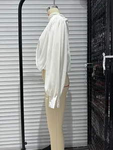 White stand collar long sleeve blouse side view detail showing elegant lantern sleeves