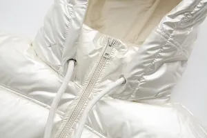 Close-up of metallic shiny hooded puffer jacket showing zipper and drawstring detail.