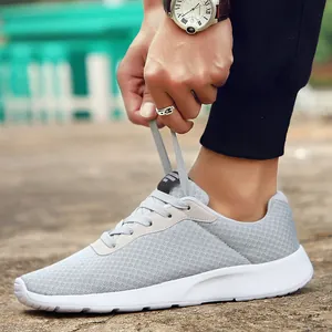 Stylish lightweight grey breathable mesh running sneakers for men and women on outdoor ground