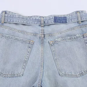 Close-up of back pockets and waistband on light blue high-waisted straight jeans