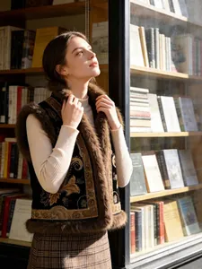 Elegant vintage beaded embroidered vest with luxury faux fur trim and floral pattern