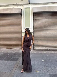 Chic dark brown knit vest with gold buttons and matching pleated skirt set for women