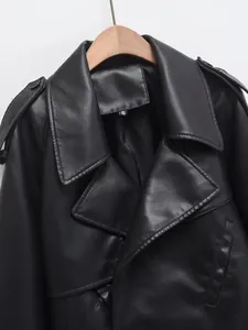 Close-up of black faux leather motorcycle jacket with lapel collar and S size label