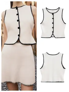 Elegant cream knit set with black scalloped trim including buttoned vest and mini skirt