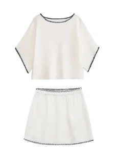 Elegant cream white knit two-piece set featuring black contrast embroidery details